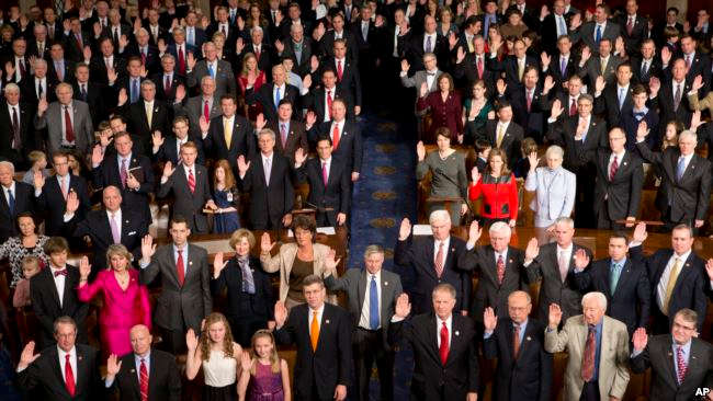 Members of the 113th Congress take the oath of office.
