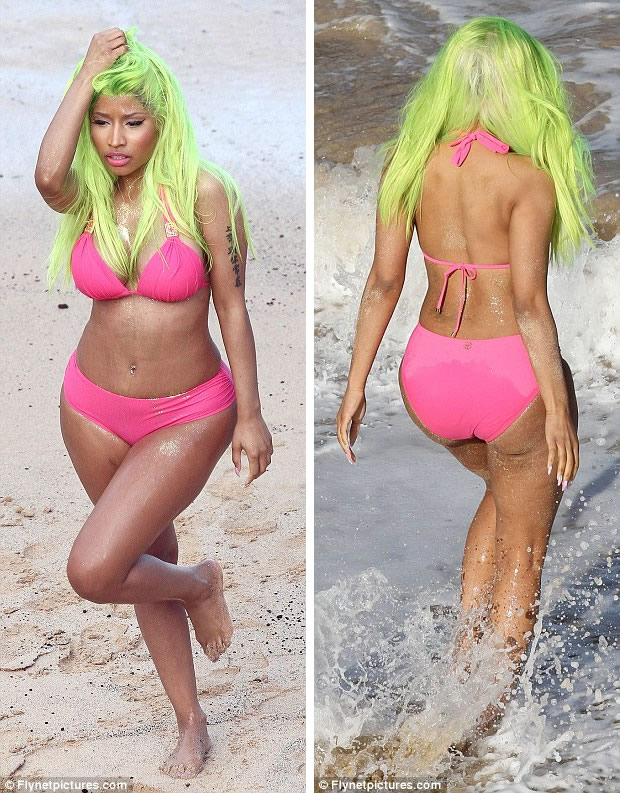Working out: Nicki, who appeared to have gold paint on her legs and derriere, said this week she found it hard to stay in shape
