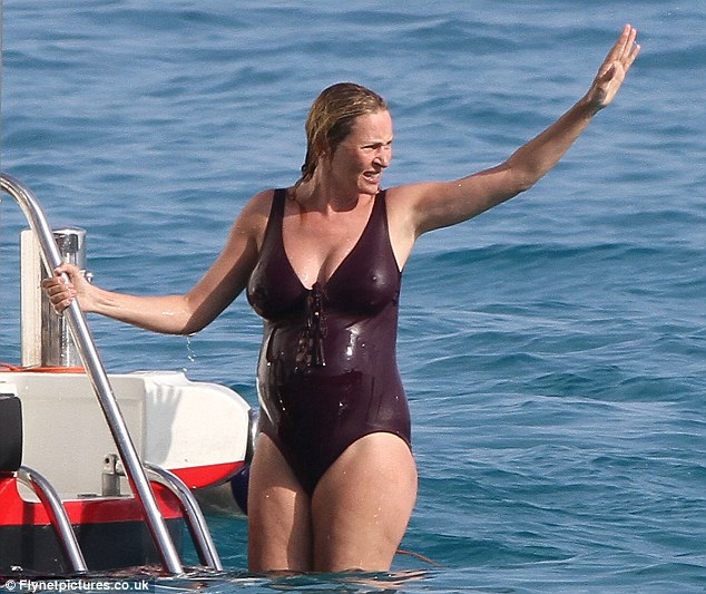 Ahoy there! The actress waved to a friend as she climbed back onto the yacht