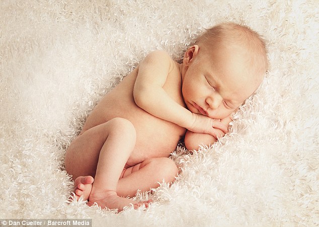 Cute as a button: Baby Edward drifts into a deep sleep during the exhausting photo shoot
