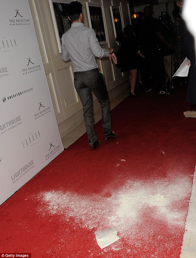 The aftermath: White powder can be seen covering the red-carpet following the ordeal 