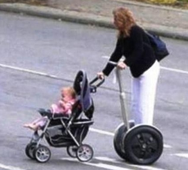 One for you, one for mummy: She might think she can multi-task, but someone needs to tell this woman pushing a stroller while riding a segway across a road is utterly stupid