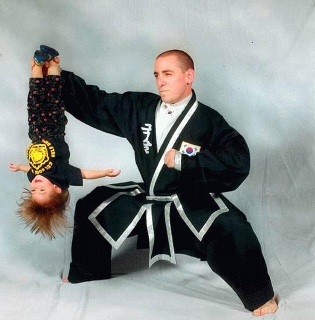 Martial arts: This toddler is dangled upside down