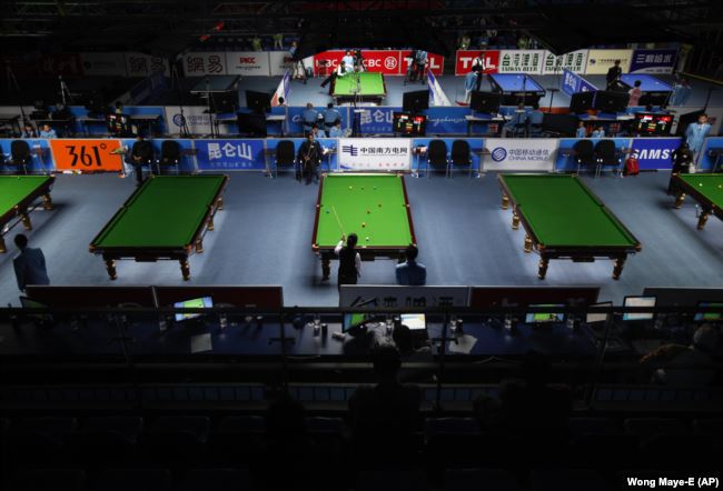 Competitors are seen playing in the billards event at the Asian Games in Guangzhou, China, 2010. (AP Photo/Wong Maye-E)