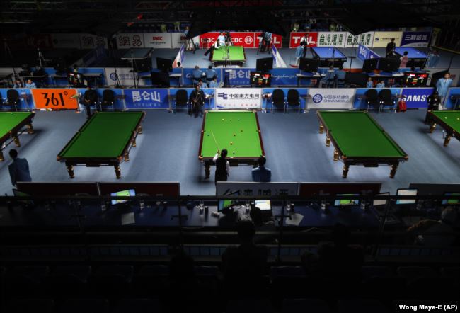 Competitors are seen playing in the billards event at the Asian Games in Guangzhou, China, 2010. (AP Photo/Wong Maye-E)