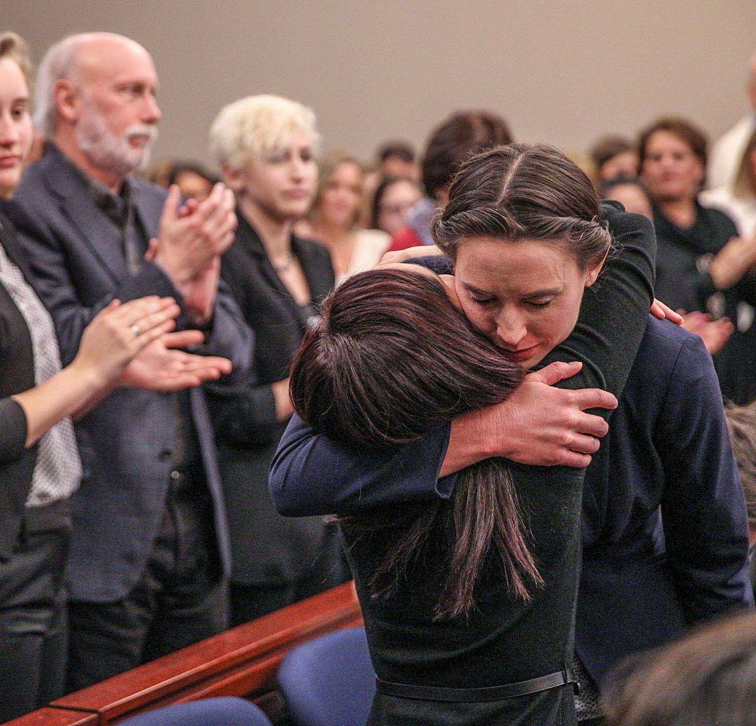 Rachael Denhollander, right, embraces Kaylee Lorincz