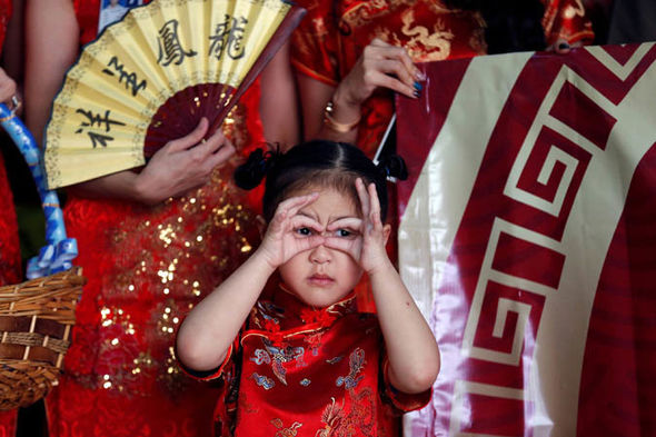 Chinese people traditionally dress in red to mark the new year