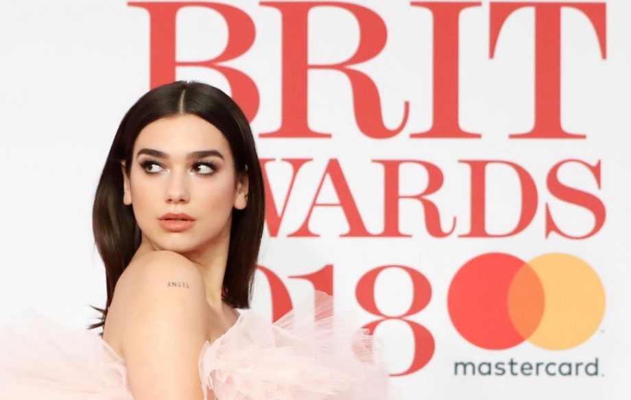 Dua Lipa used her British Female Solo Artist win at the BRIT Awards to call on women to 
