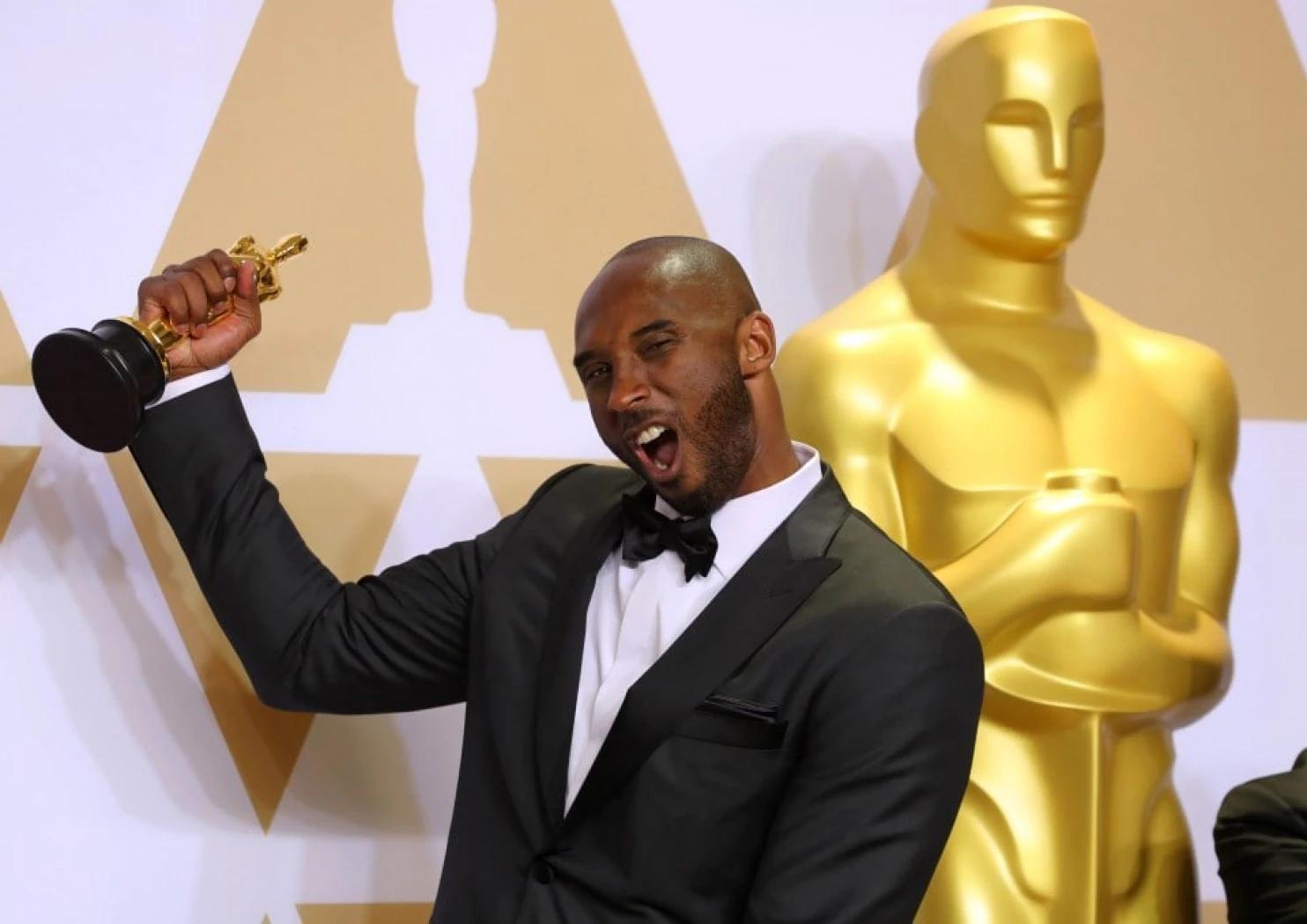 Kobe Bryant celebrates his Oscar for best animated short film. 