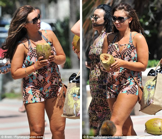 Refreshing: Lauren cooled down in the Miami heat with her coconut water