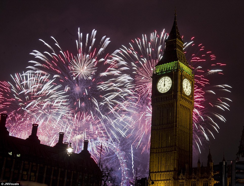 Colourful: Thousands of people have lined the banks of the Thames to see the extravagant firework display light up the capital