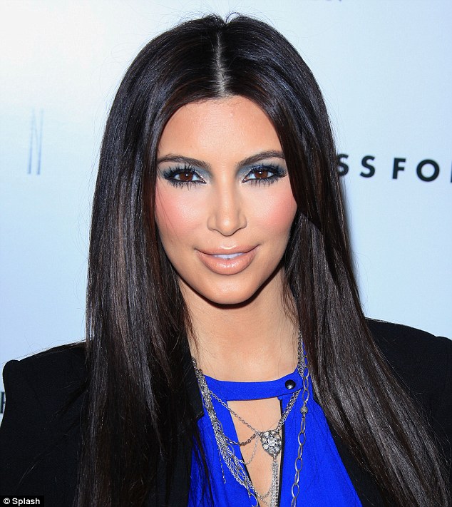 Immaculate: Kim's make-up and brunette locks were groomed to perfection before she got hit