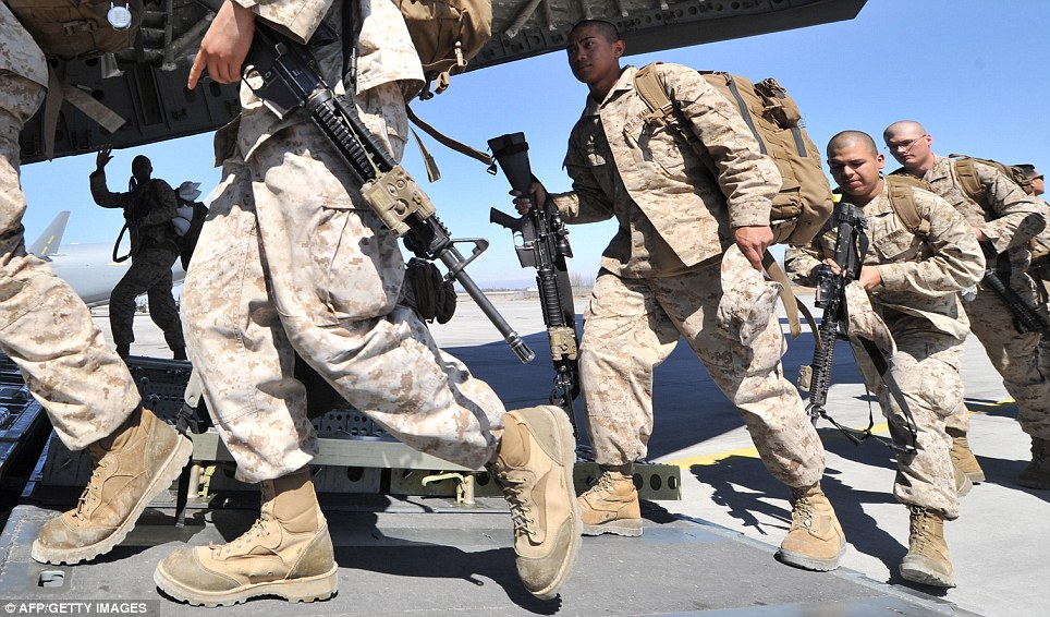 US servicemen board a plane to Afghanistan at the US transit center Manas