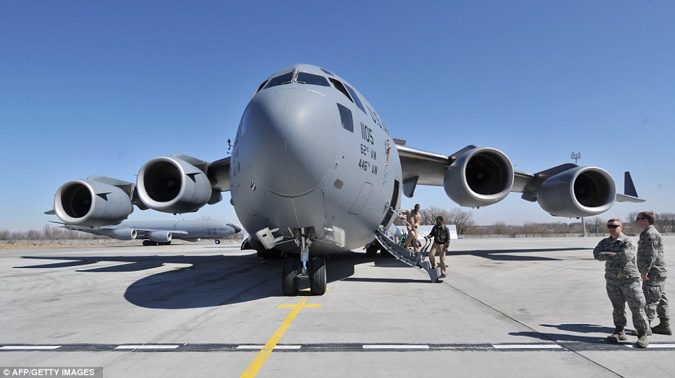 US servicemen perform their daily routines on the runway at the US transit center Manas, 30 km outside the Kyrgyzstan's capital Bishkek